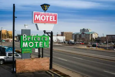 a motel sign on the side of a road at Belcaro Motel in Denver