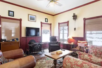 a living room with a couch and a table at Rose Street Bed & Breakfast in Georgetown