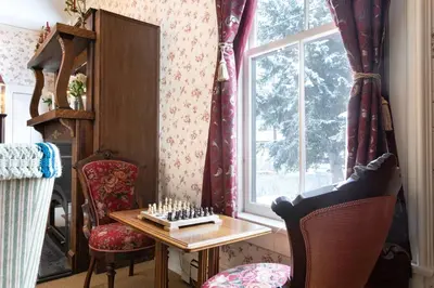 a room with a chess board on a table and a window at Rose Street Bed & Breakfast in Georgetown