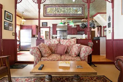 a living room with a couch and a table at Rose Street Bed & Breakfast in Georgetown