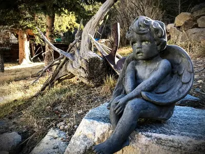 a statue of a woman sitting on a rock at Rose Street Bed & Breakfast in Georgetown
