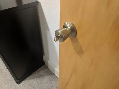 a door with a metal door knob on a wooden door at DIA BnB - Mountain View - Private floor - DIA Layover - Great entertainment and bed in Brighton