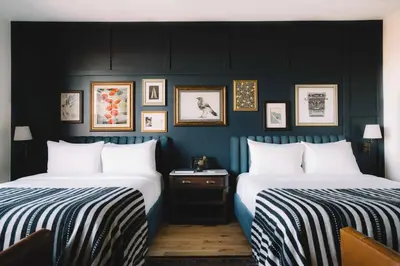 two beds sitting next to each other in a room at The Ramble Hotel in Denver