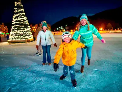a group of people playing on an ice rink at Jackpine 8021 in Keystone