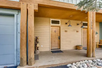 a front porch of a house with wooden posts at Ski Tip Townhomes 8713 in Keystone