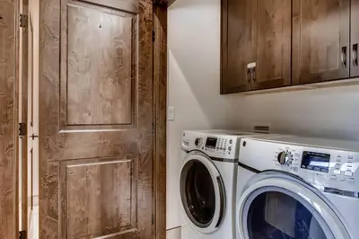 a laundry room with a washer and dryer at River Run Townhome RR38 in Keystone