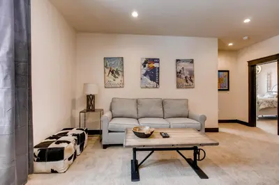 a living room with a couch and a table at River Run Townhome RR42 in Keystone