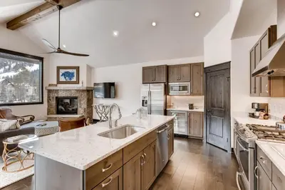 a kitchen with a sink and a counter top at River Run Townhome RR42 in Keystone