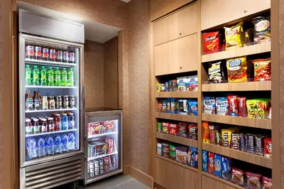 a refrigerator in a room with lots of drinks at Fairfield Inn & Suites by Marriott Boulder Longmont in Longmont