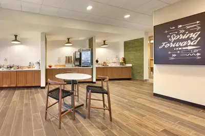a waiting room with a table and two stools at Fairfield Inn & Suites by Marriott Boulder Longmont in Longmont