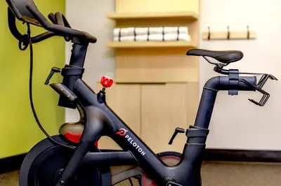 a black bike is parked in a room at Spark by Hilton Denver International Airport in Denver