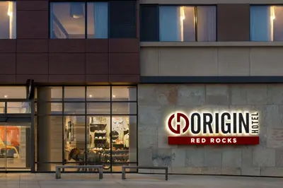 a store with a red rocks sign on the side of a building at Origin Red Rocks, a Wyndham Hotel in Golden