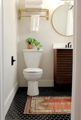 a bathroom with a toilet and a sink at Kinnikinnik Motor Lodge in Estes Park