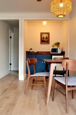 a dining room with a table and chairs at Kinnikinnik Motor Lodge in Estes Park
