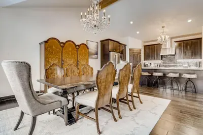 a dining room with a table and chairs at River Run Townhome RR51 in Keystone