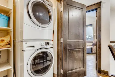 a laundry room with a washer and dryer at River Run Townhome RR51 in Keystone