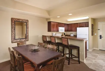 a kitchen and dining room with a table and chairs at WorldMark Granby - Rocky Mountain Preserve in Granby