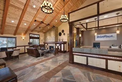 a lobby with a bar and a restaurant at WorldMark Granby - Rocky Mountain Preserve in Granby