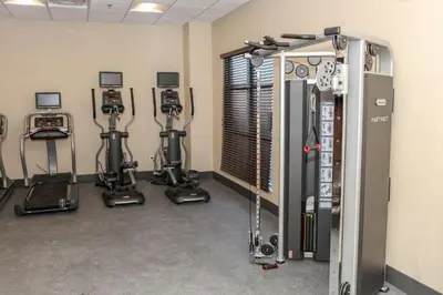 a gym with several exercise bikes in a room at Hampton Inn & Suites Lafayette in Lafayette