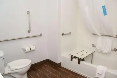 a bathroom with a toilet and a bath tub at Hampton Inn & Suites Lafayette in Lafayette