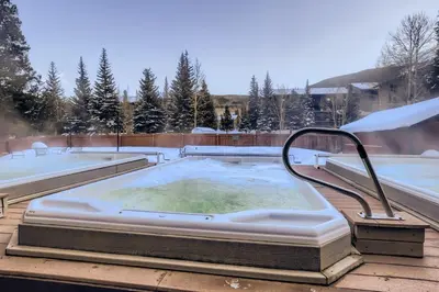 a hot tub on the roof of a house at Mountainside 523 Home in Frisco