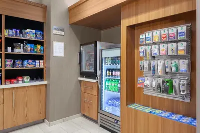 a refrigerator in a store with its door open at SpringHill Suites by Marriott Denver Tech Center in Greenwood Village