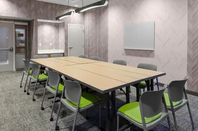 a conference room with a wooden table and chairs at SpringHill Suites by Marriott Denver Tech Center in Greenwood Village