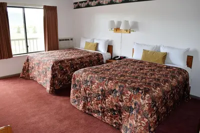 a hotel room with two beds and a window at Littletree Inn in Granby