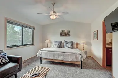 a bedroom with a bed and a ceiling fan at 732B Meadow Creek Townhouse in Frisco