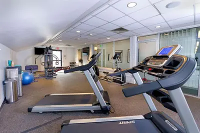 a gym with treadmill and ellipticals in a room at Holiday Inn Estes Park by IHG in Estes Park