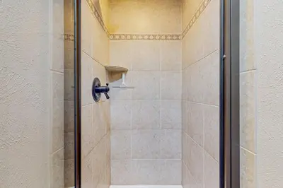 a shower with a glass door in a bathroom at Lodgepole Landing in Silverthorne