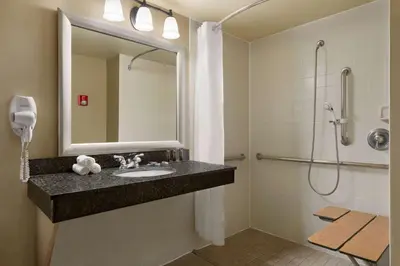 a bathroom with a sink and a shower at Wingate by Wyndham Denver Tech Center in Greenwood Village