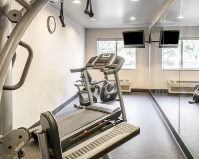 a room with a gym with a treadmill at Quality Inn Louisville - Boulder in Louisville