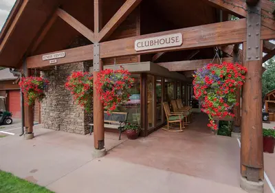 a building with flowers on the front of it at Rams Horn Village Resort in Estes Park