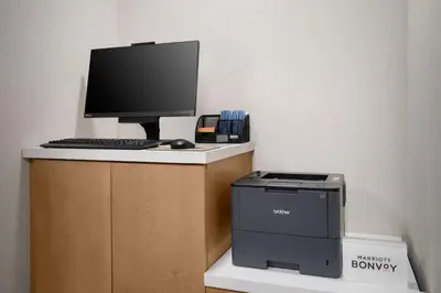 a computer sitting on top of a desk with a printer at Fairfield Inn & Suites Boulder in Boulder
