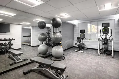a gym with several exercise equipment in a room at Fairfield Inn & Suites Boulder in Boulder