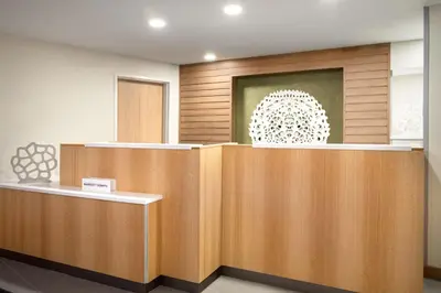 a waiting room with wooden walls and a painting on the wall at Fairfield Inn & Suites Boulder in Boulder
