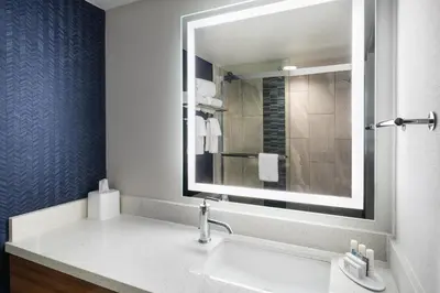 a bathroom with a sink and a mirror at Fairfield Inn & Suites Boulder in Boulder