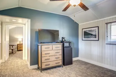 a kitchen with a refrigerator and a ceiling fan at Grand Lake Lodge in Grand Lake