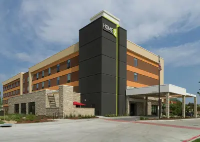 a hotel building with a sign on the front of it at Home2 Suites By Hilton Fort Collins in Fort Collins