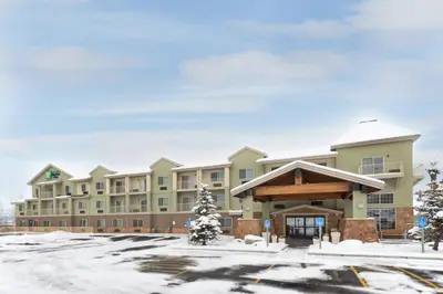 a large building with snow on the ground at Holiday Inn Express Hotel & Suites Fraser Winter Park Area by IHG in Fraser