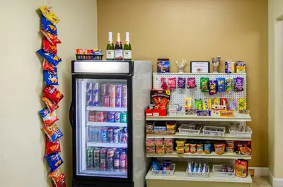 a refrigerator filled with lots of food and drinks at Americas Best Value Inn & Suites Ft Collins E at I-25 in Fort Collins