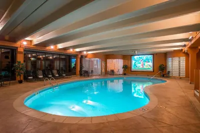 a large swimming pool in a hotel room at Winter Park Mountain Lodge in Winter Park