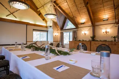 a conference room with a long table in it at Winter Park Mountain Lodge in Winter Park