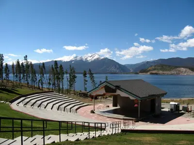 an empty amphitheater next to a lake with a mountain at Dillon Inn in Dillon