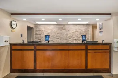 a lobby with a reception desk in a hospital at Best Western Plus Boulder Louisville in Louisville