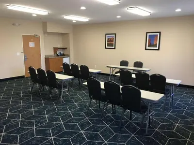 a conference room with tables and chairs in it at Best Western Plus Gateway Inn & Suites - Aurora in Aurora