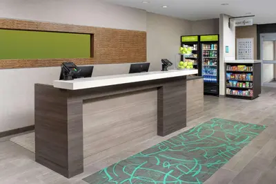 a lobby of a store with a reception desk at Home2 Suites By Hilton Longmont in Longmont