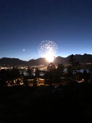 a firework display in the sky at night at Estes Lake Lodge in Estes Park
