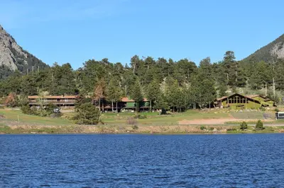 a view of the lodge from the lake at Estes Lake Lodge in Estes Park